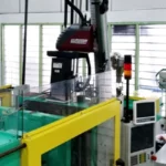 INJECTION MACHINES WITH ROBOTIC ARM